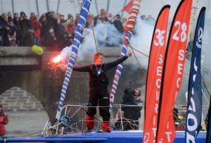 French skipper François Gabart celebrates after winning the 7th edition of the Vendee Globe solo round-the-world race on January 27, 2013 off the coasts of Les Sables d'Olonne, western France. Gabart, 29, is the youngest skipper in the event. He set a new record with 78 days 02 h and 16 min, beating the previous record time set at 84 days 3hr 9min by 2009 winner Michel Desjoyeaux. AFP PHOTO DAMIEN MEYER / AFP / DAMIEN MEYER